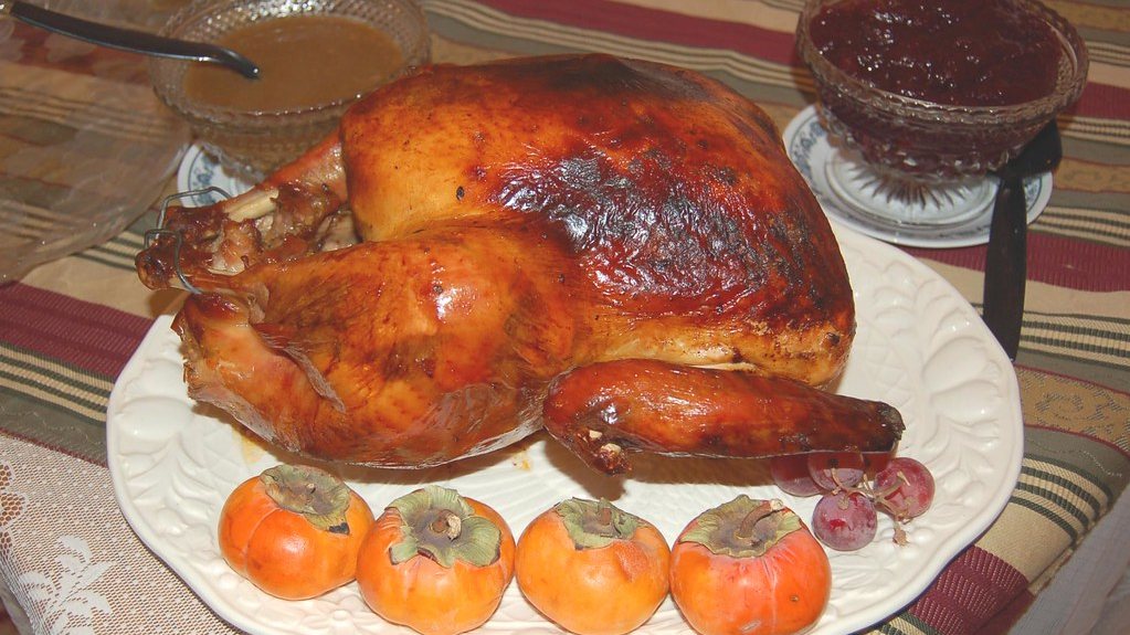 Whole roast turkey on a platter for Christmas dinner