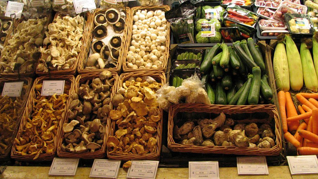 Display of fresh mushrooms and vegetables